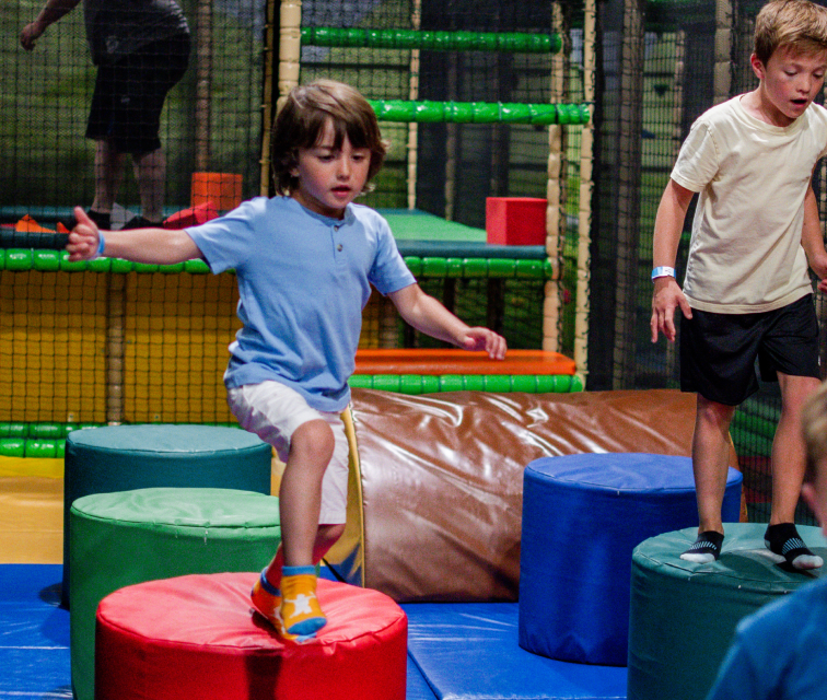 Children playing on obstacle course