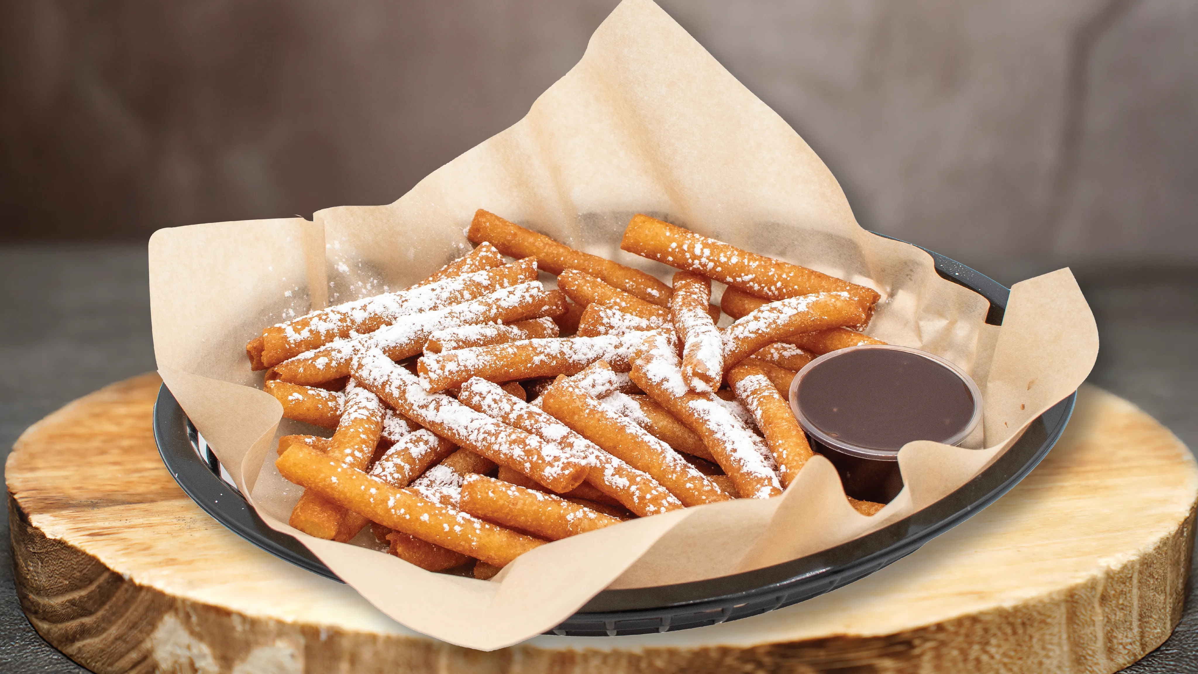 Funnel fries dusted with powdered sugar