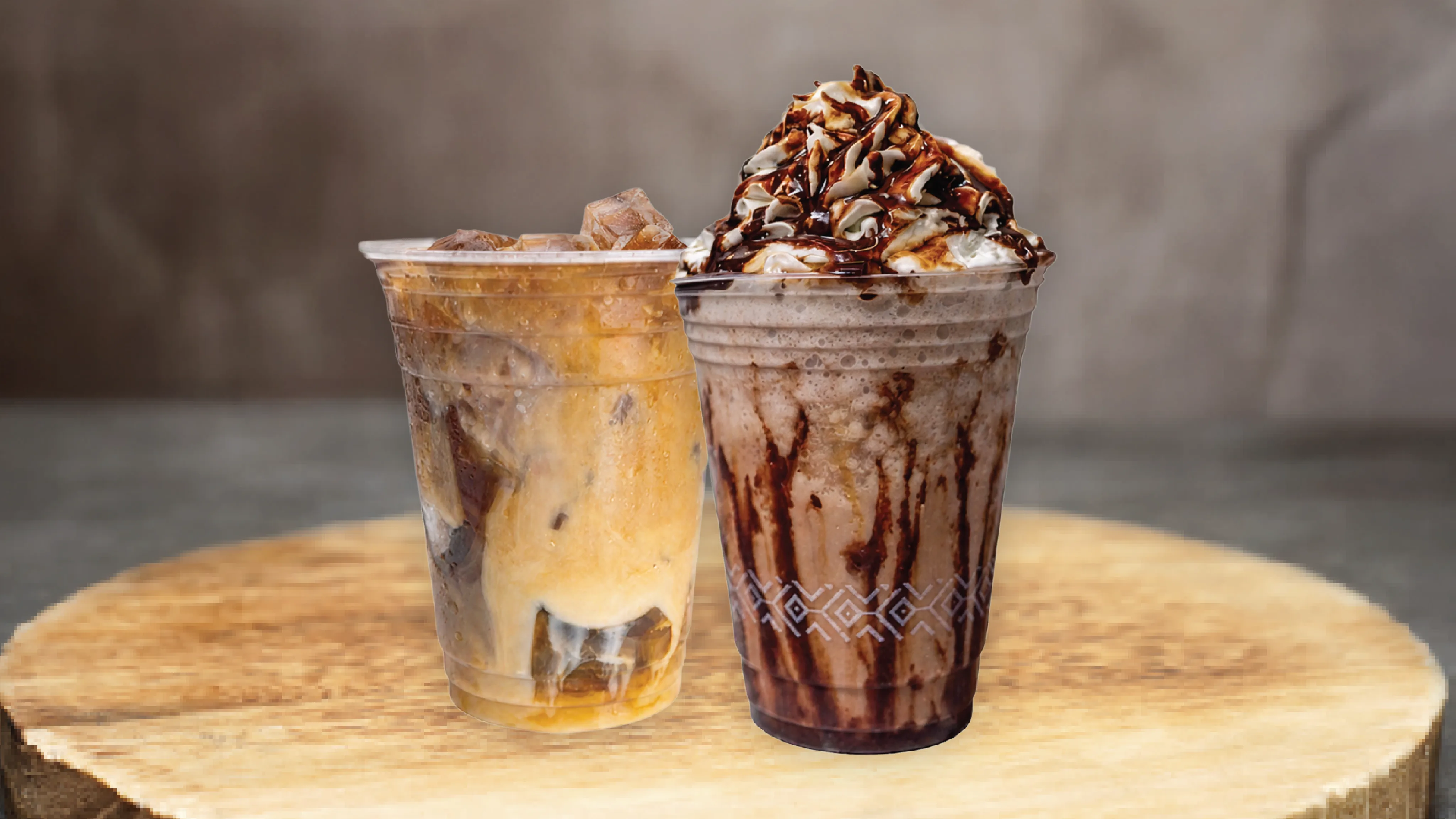 An iced coffee and a whipped-cream topped milkshake